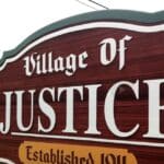Village of Justice sign