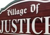 Village of Justice sign